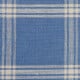 Ecru checkered linen fabric on a blue background